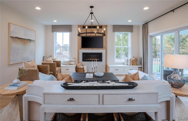 living room featuring a notable chandelier