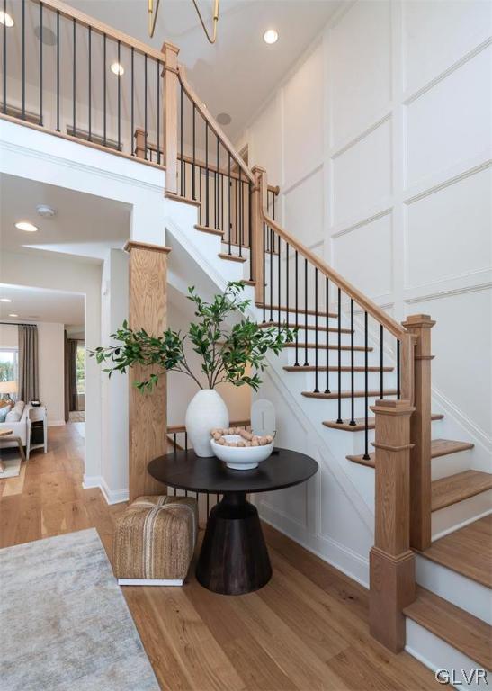 staircase featuring hardwood / wood-style flooring