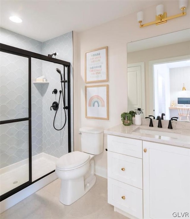 bathroom with walk in shower, toilet, and vanity