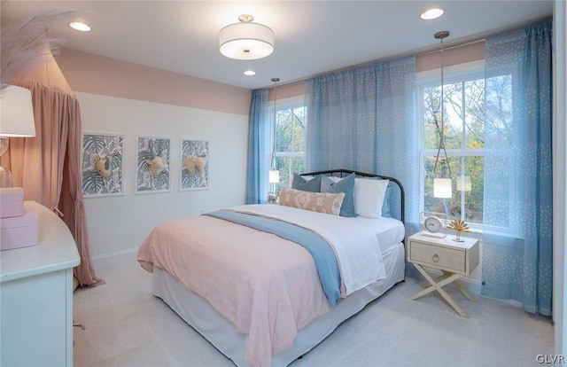 bedroom with light colored carpet