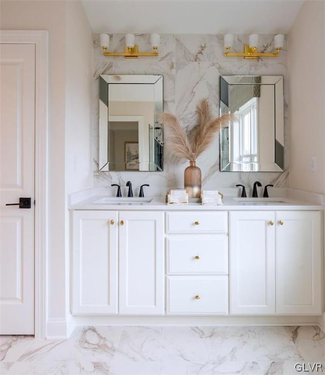 bathroom with double vanity and tile patterned flooring