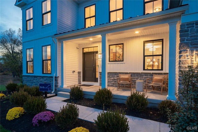 doorway to property featuring a porch