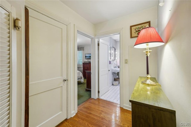 hall featuring wood finished floors