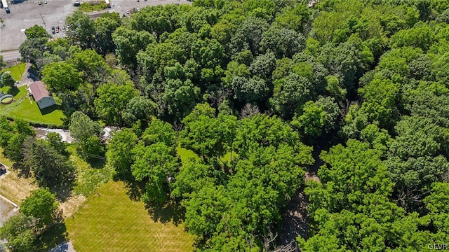 aerial view featuring a wooded view