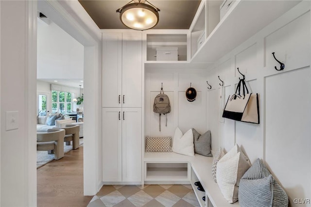 mudroom with light hardwood / wood-style flooring