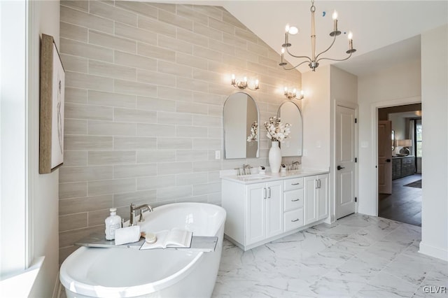 bathroom with vaulted ceiling, tile patterned flooring, tile walls, and double vanity