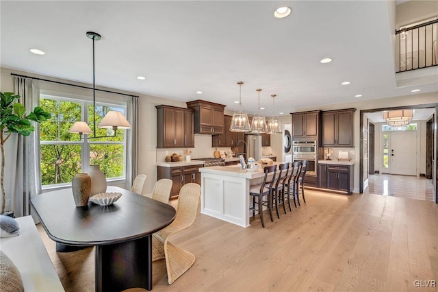 dining area with light hardwood / wood-style flooring