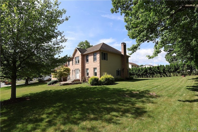 view of home's exterior featuring a lawn