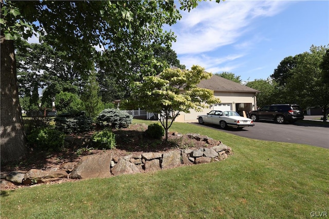 view of yard with a garage