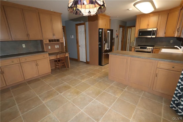 kitchen with stainless steel appliances, decorative backsplash, light brown cabinetry, built in desk, and sink