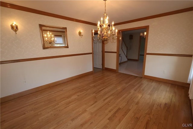 unfurnished room with crown molding and hardwood / wood-style flooring