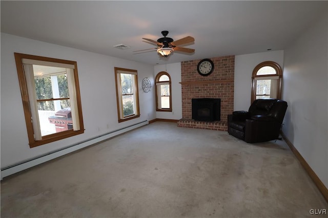 unfurnished living room featuring ceiling fan, light colored carpet, baseboard heating, and a brick fireplace