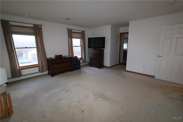 unfurnished bedroom with light colored carpet