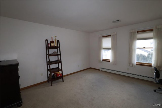 interior space featuring a baseboard radiator and light carpet