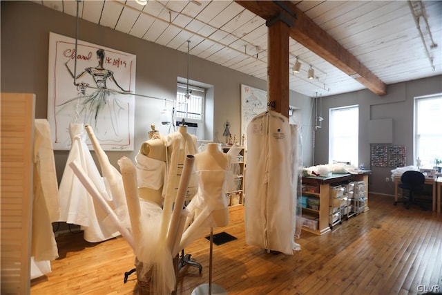 interior space featuring beamed ceiling, hardwood / wood-style flooring, and wood ceiling