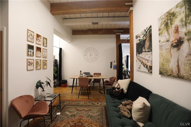 living room with beamed ceiling, wooden ceiling, and hardwood / wood-style floors