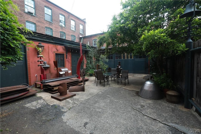 view of patio with a fenced backyard and outdoor dining area
