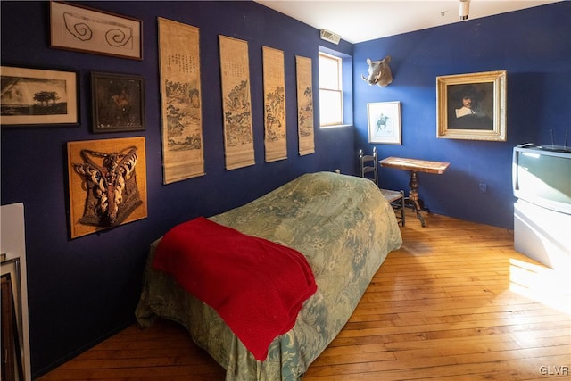 bedroom featuring hardwood / wood-style floors