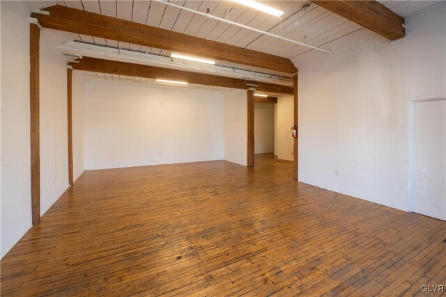 finished basement featuring hardwood / wood-style flooring and wood ceiling