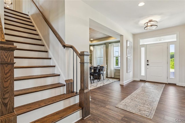 foyer entrance featuring dark hardwood / wood-style floors