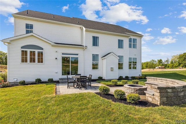 back of house with a yard and a patio area