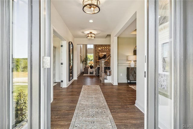 hall with dark hardwood / wood-style flooring