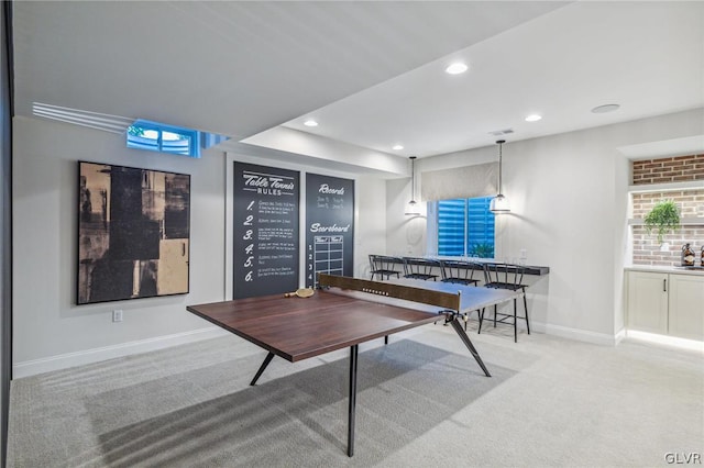 game room with light colored carpet