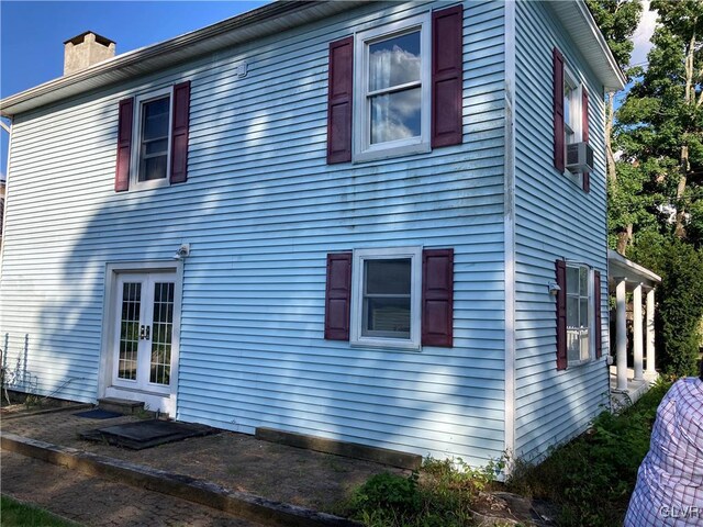 view of side of home featuring french doors