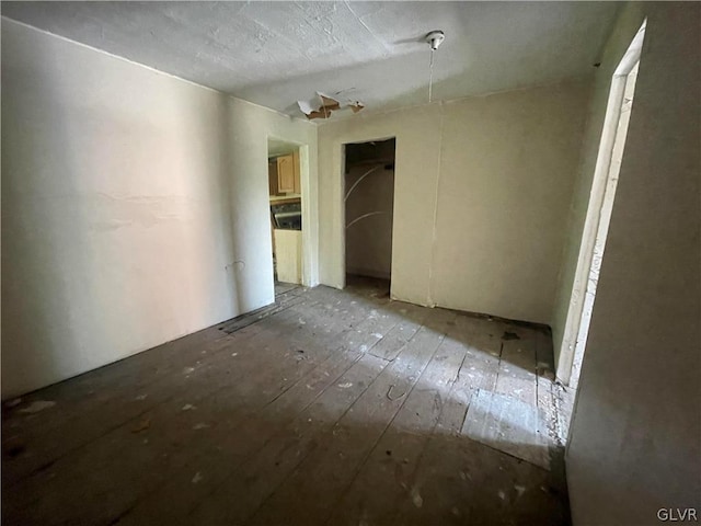 empty room featuring hardwood / wood-style flooring