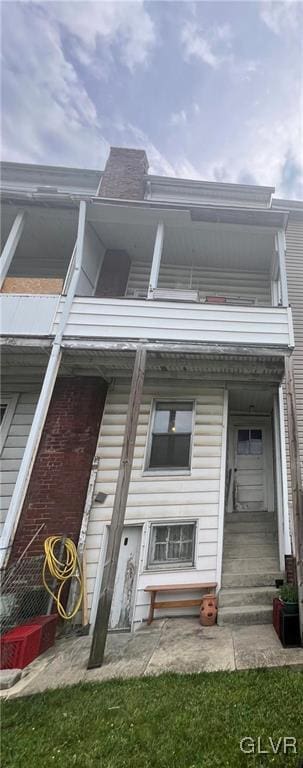 view of property with a balcony