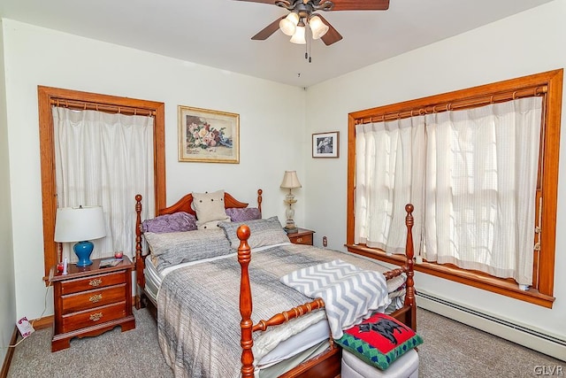 bedroom featuring a baseboard radiator, ceiling fan, and carpet floors