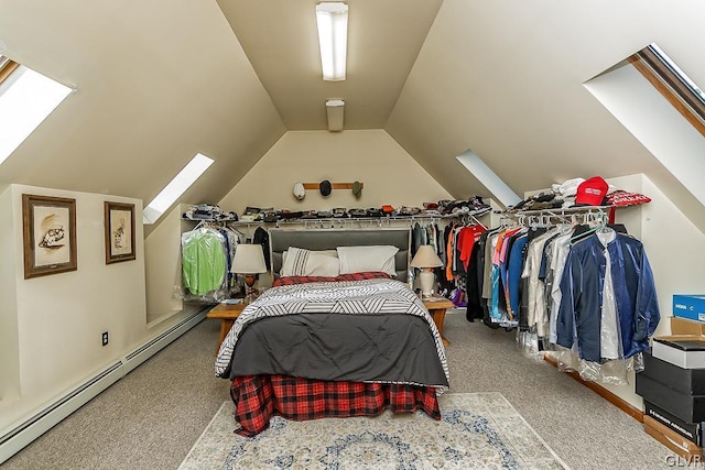 carpeted bedroom featuring lofted ceiling with skylight and a baseboard heating unit