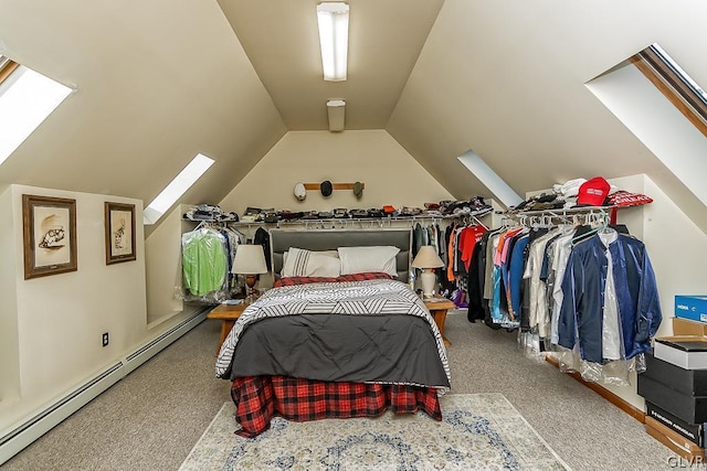 carpeted bedroom featuring lofted ceiling with skylight and baseboard heating