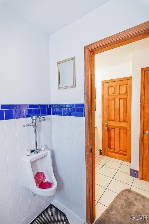 bathroom featuring tile walls and tile patterned flooring