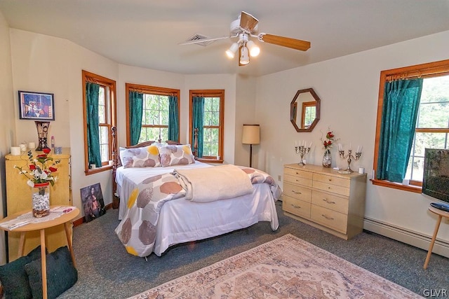 carpeted bedroom with baseboards, ceiling fan, and baseboard heating