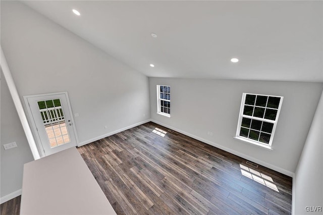 unfurnished living room with high vaulted ceiling and hardwood / wood-style flooring