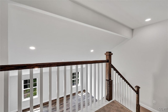 stairs featuring hardwood / wood-style flooring