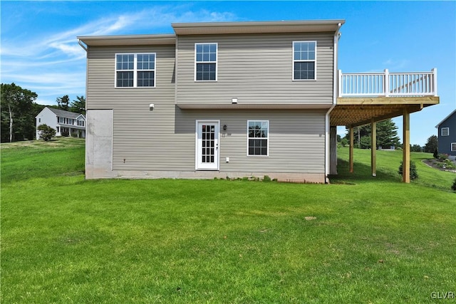 rear view of house with a yard