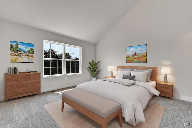 bedroom featuring high vaulted ceiling and light carpet