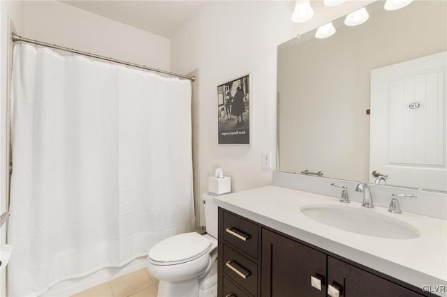 bathroom with vanity, toilet, a shower with curtain, and tile patterned floors