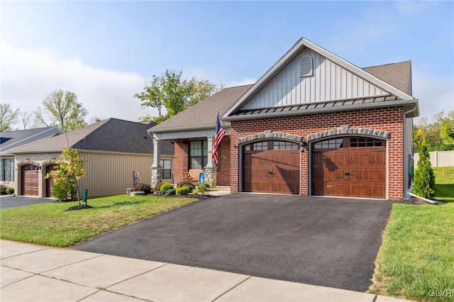 view of front of home with a garage and a front lawn