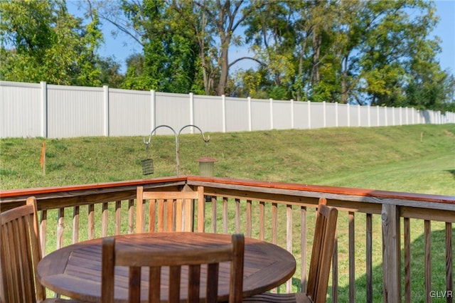 wooden deck with a yard