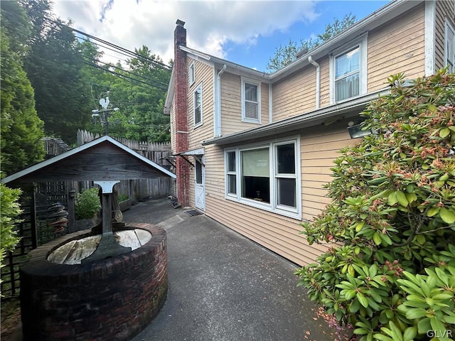 view of property exterior with a patio