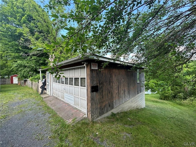 exterior space featuring a yard and a garage