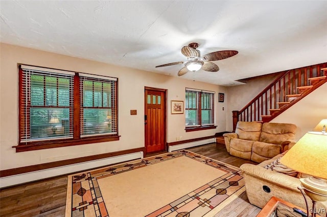 interior space featuring ceiling fan, hardwood / wood-style flooring, and a baseboard radiator