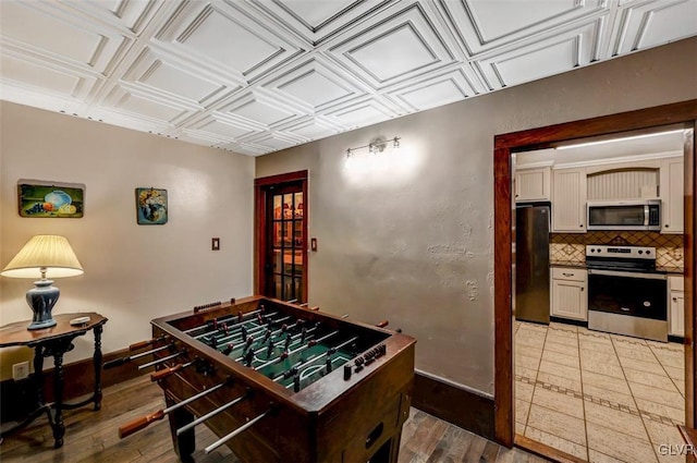 playroom featuring light wood-type flooring