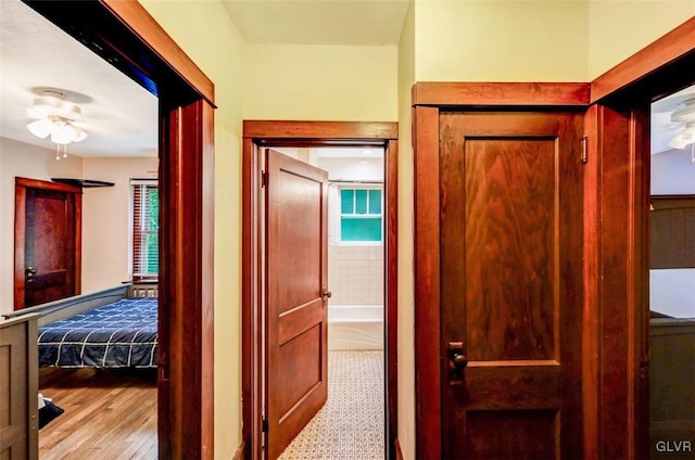 hallway featuring light tile patterned floors