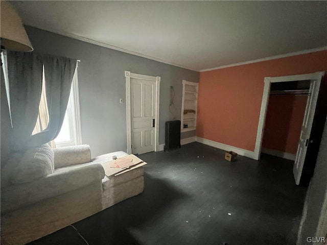 unfurnished living room featuring crown molding