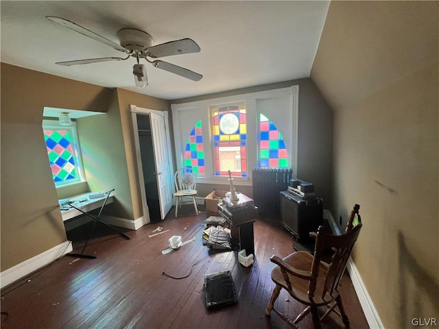 interior space featuring dark hardwood / wood-style floors, ceiling fan, and lofted ceiling