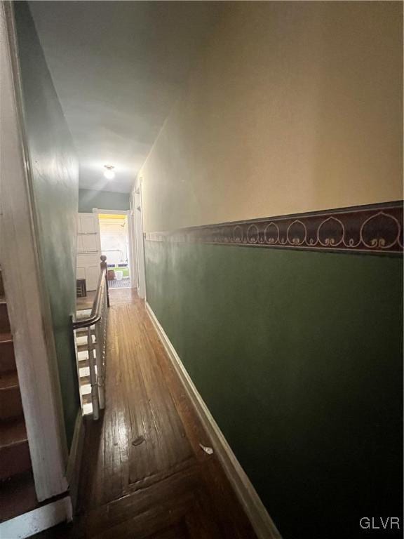 hall with hardwood / wood-style floors and lofted ceiling